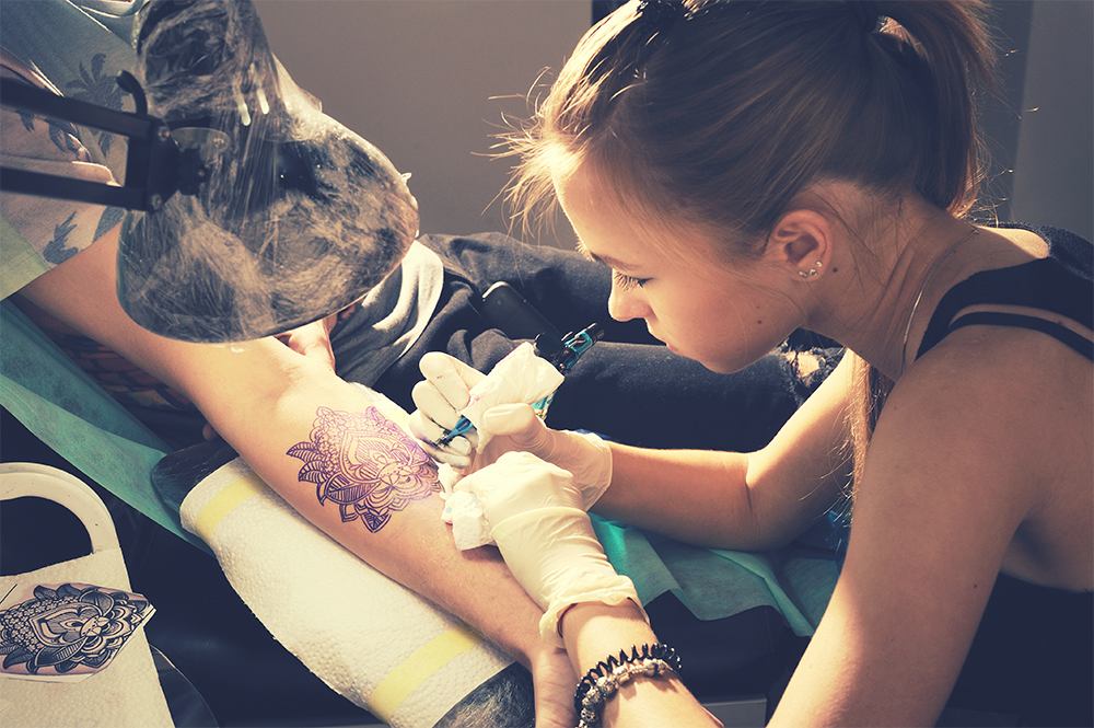 tattoo artist tattooing